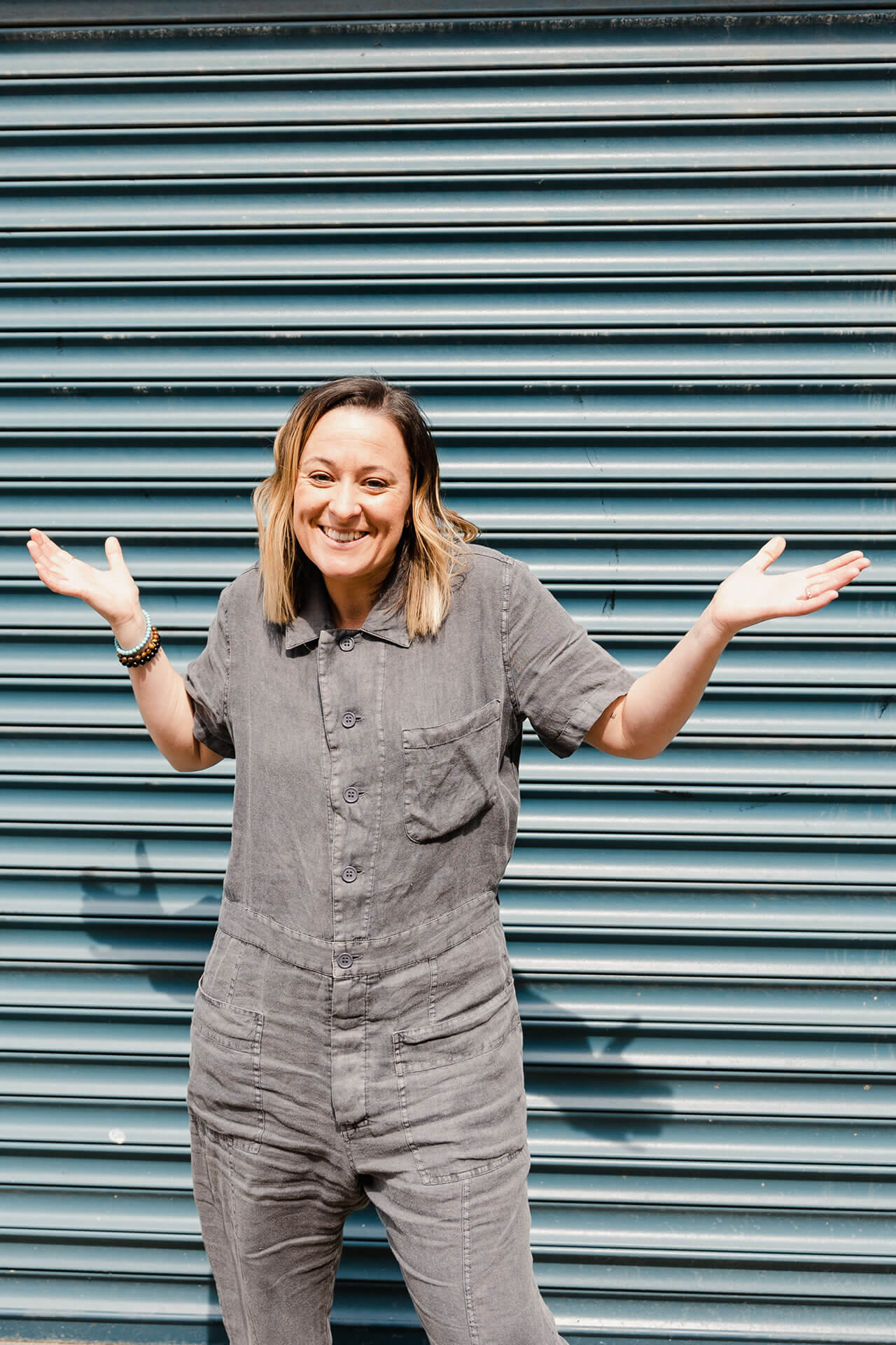Kiera smiling in front of shutters. Kiera smiling in front of shutters.